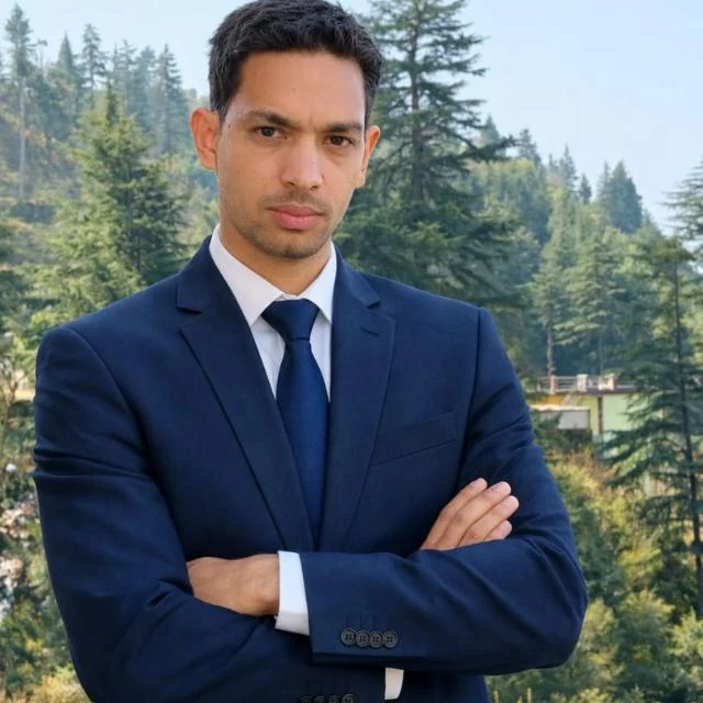 Portrait of Govinda in a navy suit